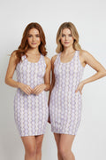 Sleeveless dress with a pattern on a white background